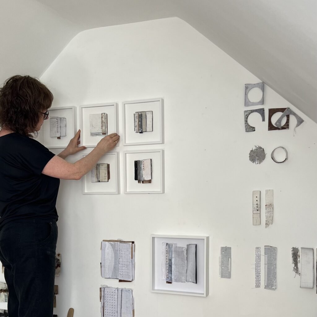 me in studio hanging work